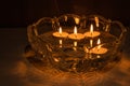 Fortune telling with floating candles. 4 burning candles float in a crystal bowl with water
