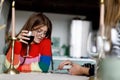 Fortune telling on tarot cards, a young woman with a glass of wine predicts her fate