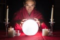 Fortuneteller Holding Hands Around A Glowing Ball