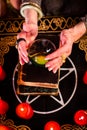 Fortuneteller during Seance with crystal ball Royalty Free Stock Photo