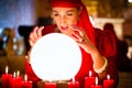 Fortuneteller at Seance or session with Crystal ball Royalty Free Stock Photo