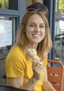 Forty five year old woman enjoying and ice cream cone on family vacation, Seattle, Washington