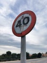 Forty miles per hour speed limit sign against a partly cloudy sky Royalty Free Stock Photo