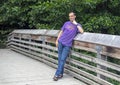 Forty-two yearold Caucasian man posing on a wooden bridge in the Washington Park Arboretum, Seattle, Washington