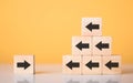 Forward and backward arrows on wooden blocks, Different, symbolizing the concept of thought development. Process of reflecting on