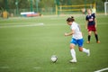 Forward of CSP Izmailovo dribbles ball in game against team Mordovochka