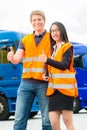 Forwarder in front of trucks on a depot Royalty Free Stock Photo