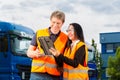 Forwarder in front of trucks on a depot Royalty Free Stock Photo