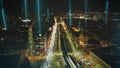 Forwards fly above busy multilane thoroughfare with elevated ubahn tracks. Aerial view of evening city. Vienna, Austria