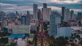 Forwards fly above busy multilane thoroughfare in metropolis at sunset. Aerial hyperlapse shot. Transport in big city