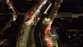 Forwards fly above busy wide thoroughfare. High angle view of various modes of transport in evening city. Vienna