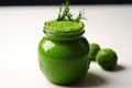 fotball shaped jar full of green detox smoothie