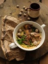 Country food. a crock pot with a mushroom platter and a small cup Royalty Free Stock Photo