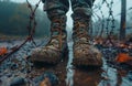 Fotografia military boots standing in the mud