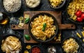 Fotografia Obraz Various types of pasta in bowls on black background Royalty Free Stock Photo