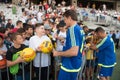 Fottball player signing autographs