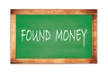 FOUND MONEY text written on green school board