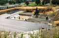 Foundation ditch with construction machinery at construction sit