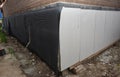 Foundation foam insulation boards with waterproofing, damp proofing. Passive house foundation insulation and waterproofing for