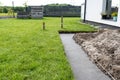 Foundation footings poured in a ditch in the yard, building a terrace in the backyard. Royalty Free Stock Photo
