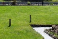 Foundation footings poured in a ditch in the yard, building a terrace in the backyard. Royalty Free Stock Photo