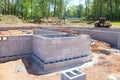 Foundation of a house on construction site is constructed cement blocks that will support wall Royalty Free Stock Photo
