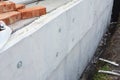 Foundation insulation. House foundation wall construction with foam insulation, damp proof, water proof layers