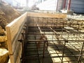 Foundation site of new building, details and reinforcements with steel bars and wire rod, preparing for concrete pouring Royalty Free Stock Photo