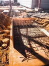 Foundation site of new building, details and reinforcements with steel bars and wire rod, preparing for concrete pouring Royalty Free Stock Photo