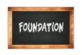 FOUNDATION text written on wooden frame school blackboard