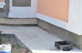 Foundation waterproofing, house wall vapor barrier. House Foundation wall waterproofing construction with concrete path and gutter Royalty Free Stock Photo