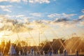 Fountain against the sky in the sun at sunset Royalty Free Stock Photo