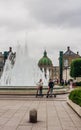 Fountain in Amaliehaven on waterfront with Amalienborg or Royal Palace and Marble Church in Copenhagen. Denmark