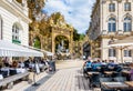 Fountain of Amphitrite and sidewalk restaurant on the Stanislas square in Nancy, France