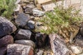 Fountain as garden decor from stones Royalty Free Stock Photo