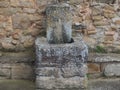 Fountain with a basin and a spout in the town square of Rialb, Lleida, Spain, Europe