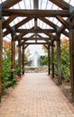 Fountain Beyond Rose Trellis