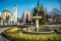 Fountain in Buen Retiro park with San Manuel and San Benito church on the background