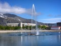 Fountain in the center of Kirovsk city with Khibiny mountains in the background, Russia, June 2019 Royalty Free Stock Photo