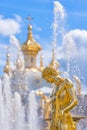 Fountain and church of the palace of Peterhof. St Petersburg, Russia Royalty Free Stock Photo