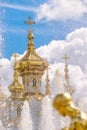 Fountain and church of the palace of Peterhof. St Petersburg, Russia Royalty Free Stock Photo