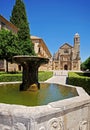 Fountain with church to the rera, Ubeda, Spain.