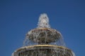 Fountain classical form in three round bowls with cascade jets in city park.