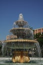 Fountain classical form in three round bowls with cascade jets in city park.