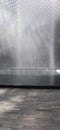 Fountain closeup part view with grey tiled floor