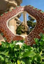 Fountain covered with colorful mosaic at the top of the main entrance staircase at Park GÃÂ¼ell