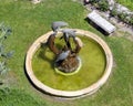 Fountain with dancing dolphins in the sculpture garden of the five star hotel, Chateau de la Chevre Dor in Eze, France