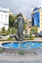 Fountain-depicting a woman standing on the edge of the bowl with arms apart