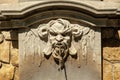 Fountain with a devils head in the city of Annecy in France