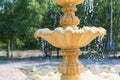 Fountain element close-up. The concept of summer freshness and vacation. Flying drops of water.